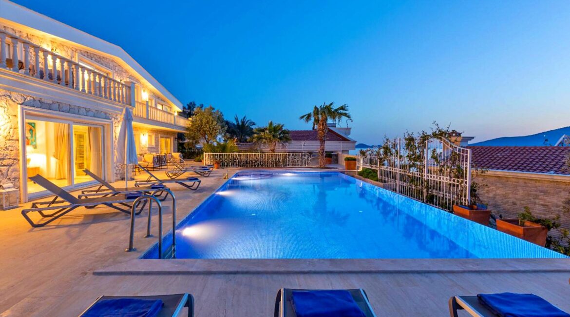 Private pool and sun terrace at Villa Bahce Kalkan with sea views and outdoor loungers.
