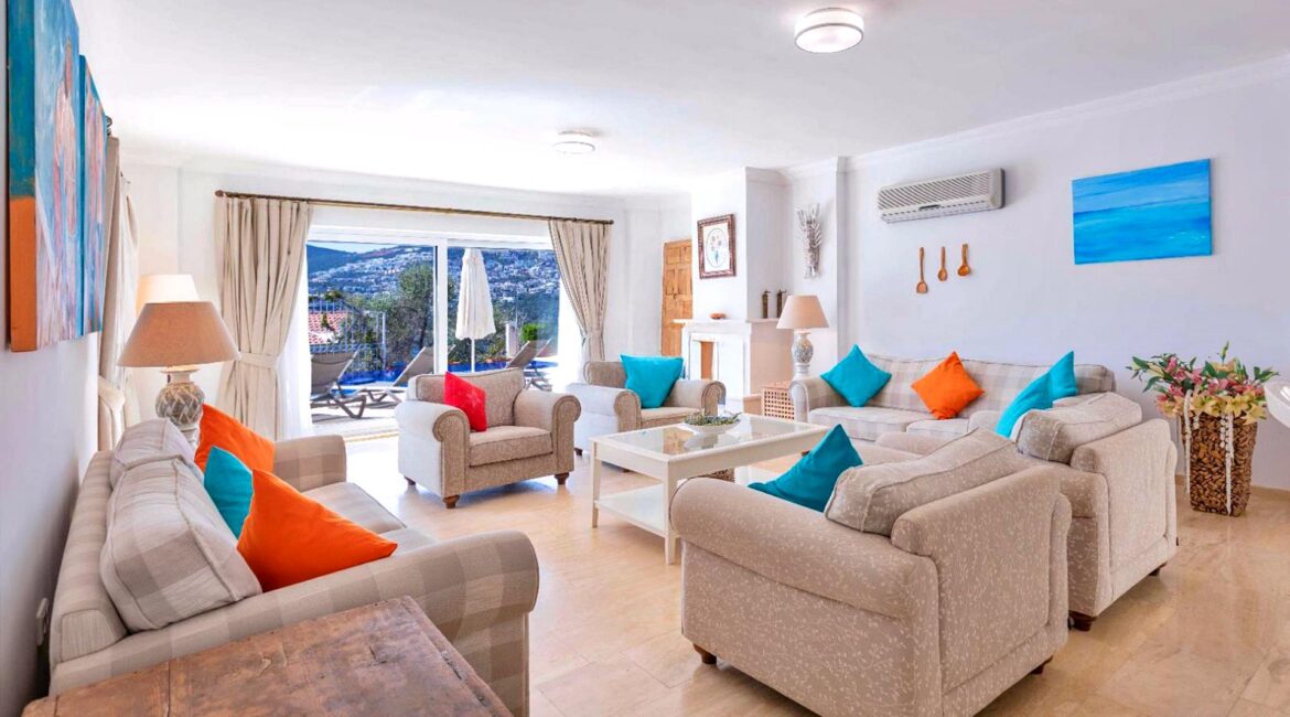 Spacious sitting room at Villa Bahce Kalkan with comfortable sofas and bright interiors.