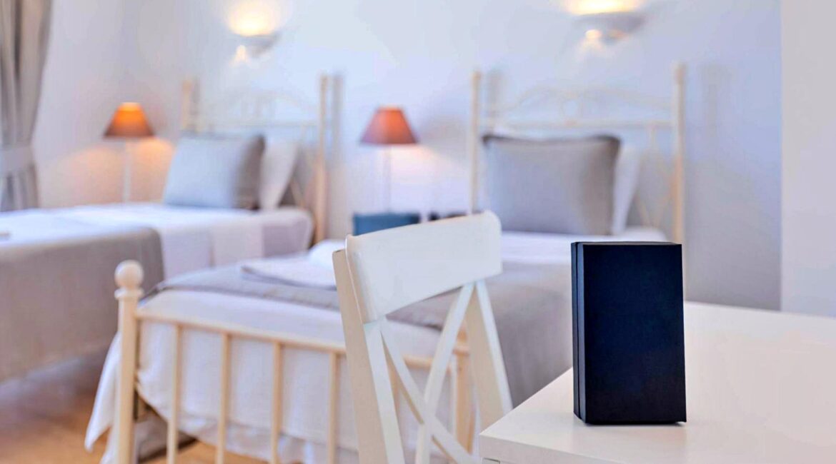 Twin bedroom at Villa Bahce Kalkan with two single beds and soft neutral interiors.