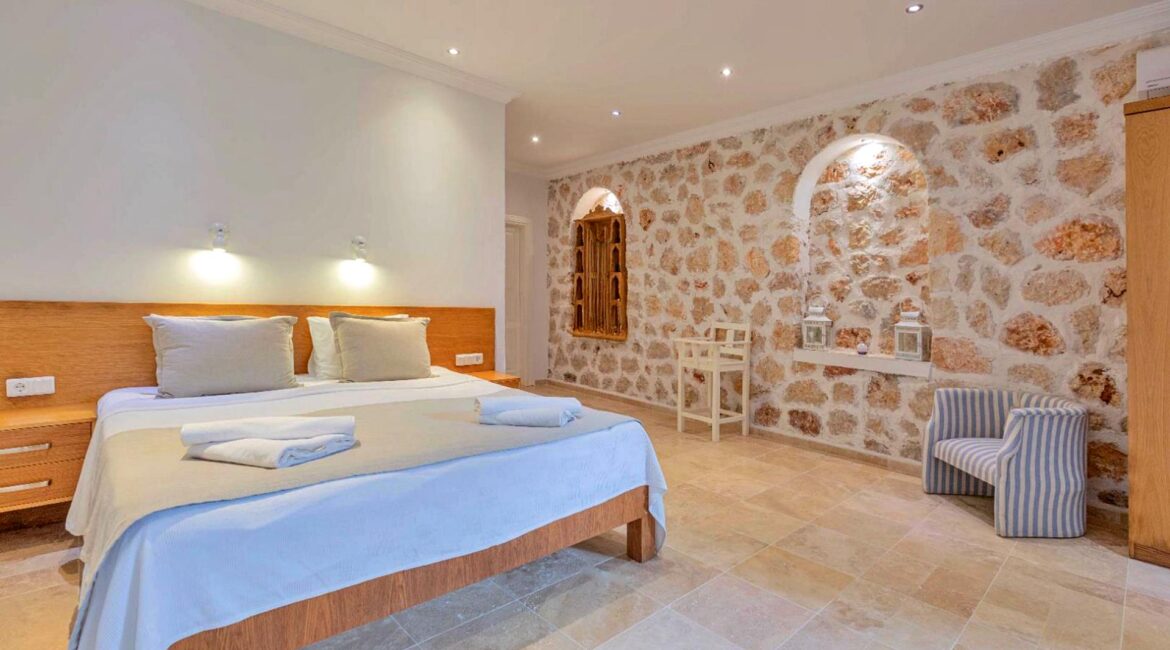 Villa Bahce Kalkan double bedroom with natural stone feature wall and ensuite accommodation