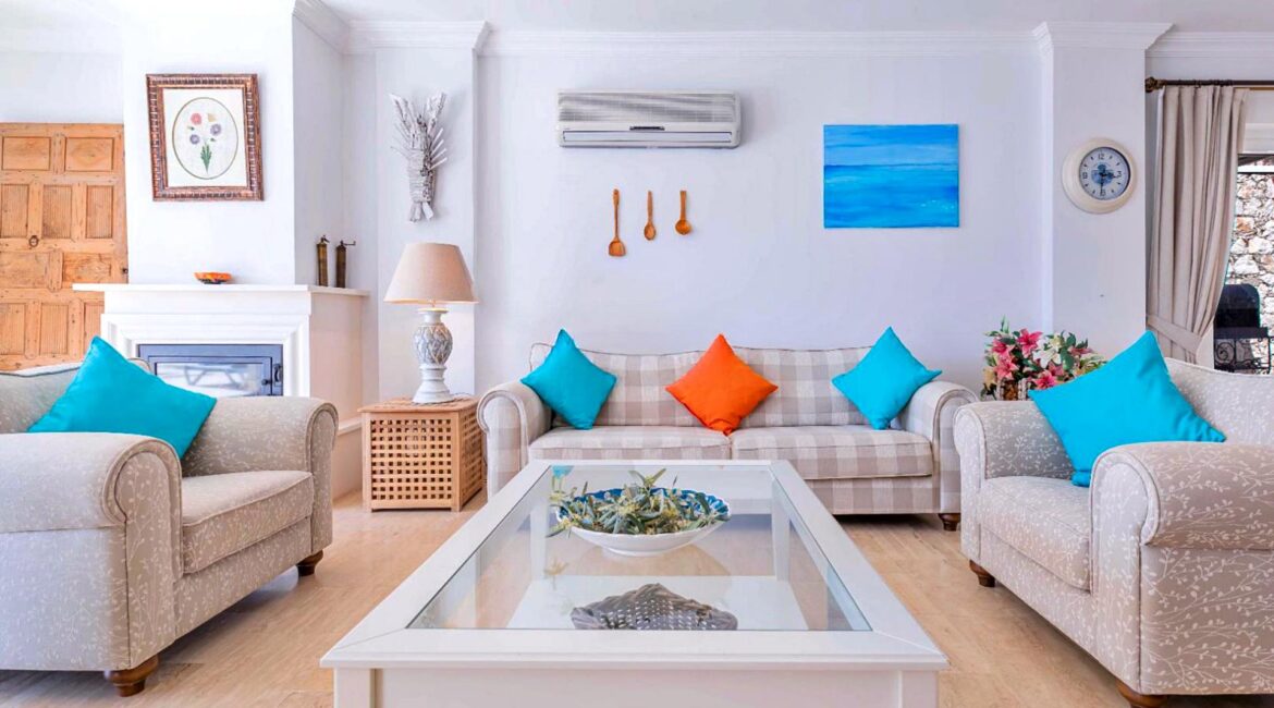 Bright sitting room at Villa Bahce Kalkan with comfortable sofas and spacious open-plan living area