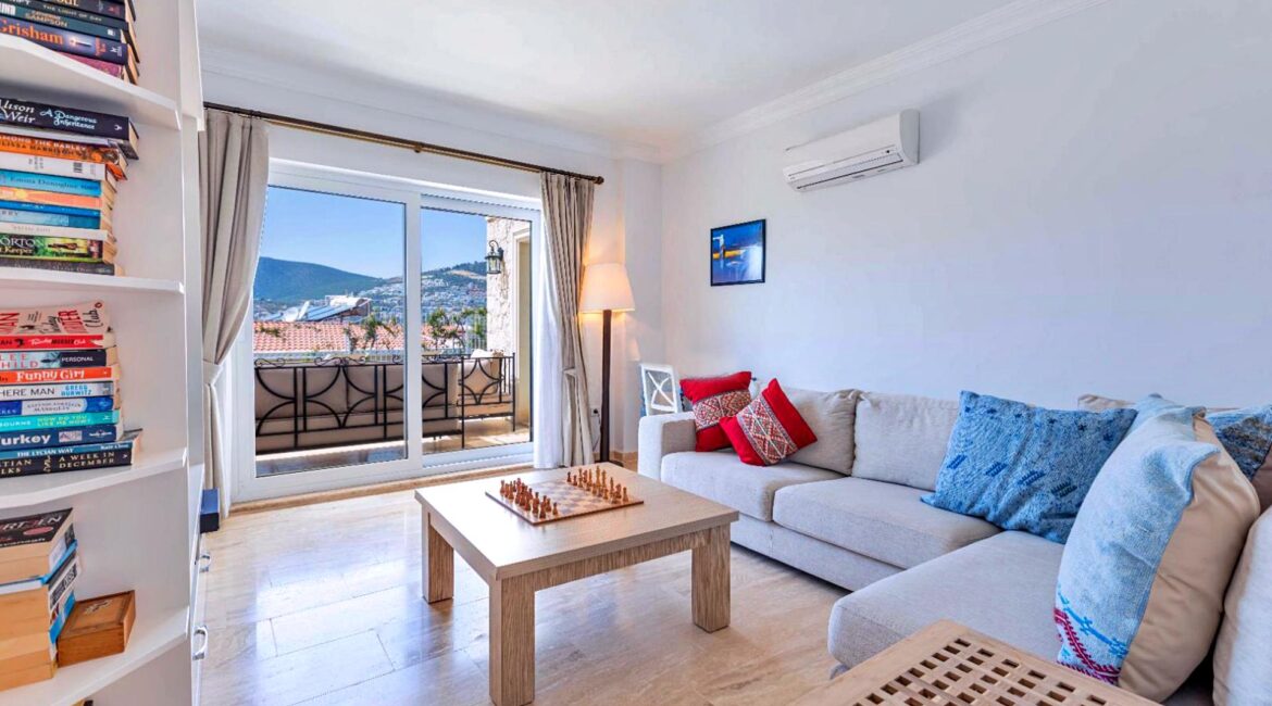 Comfortable sitting room at Villa Bahce Kalkan with large windows and seating area