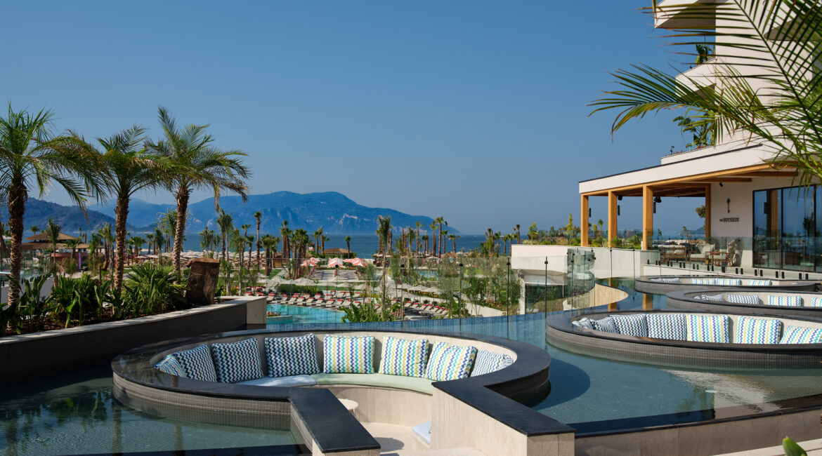 Poolside bar and lounge area at XO Cape Arnna resort in Fethiye