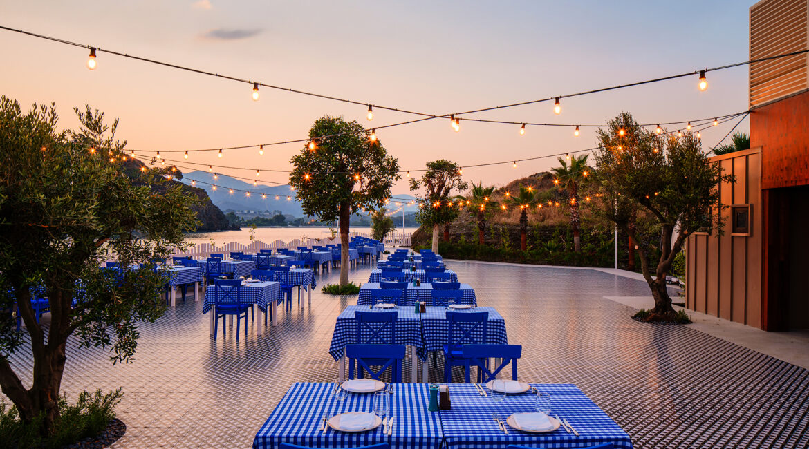 Seafront terrace dining at Margaritari Tavern at XO Cape Arnna resort