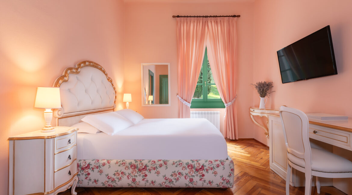 Elegant bedroom with soft pastel tones at Villa Sostaga