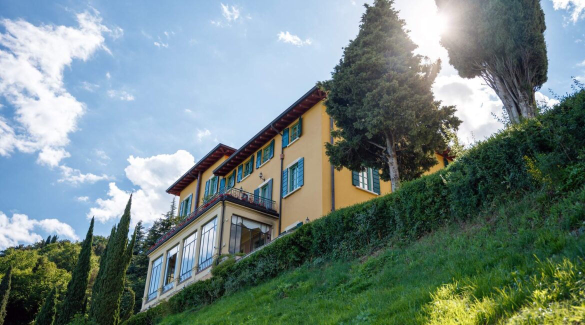 Exterior of Villa Sostaga boutique hotel set on the hillside above Lake Garda