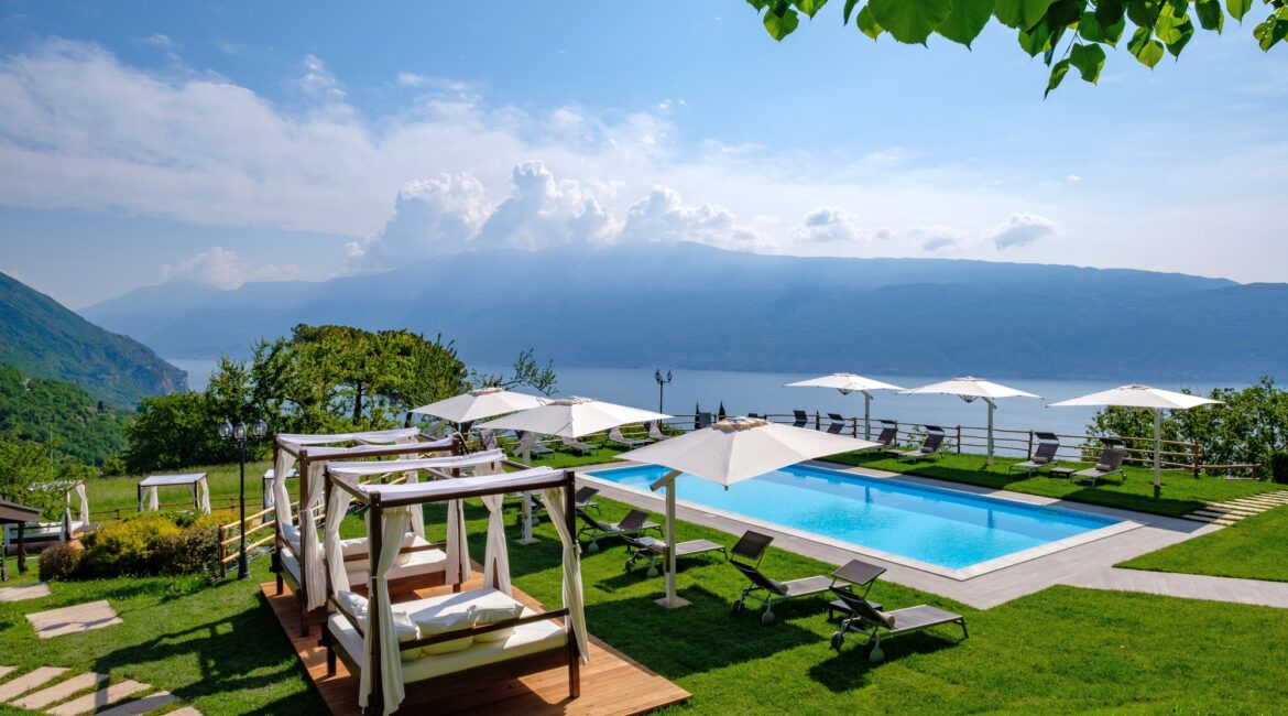 Garden pergolas and infinity pool at Villa Sostaga overlooking Lake Garda