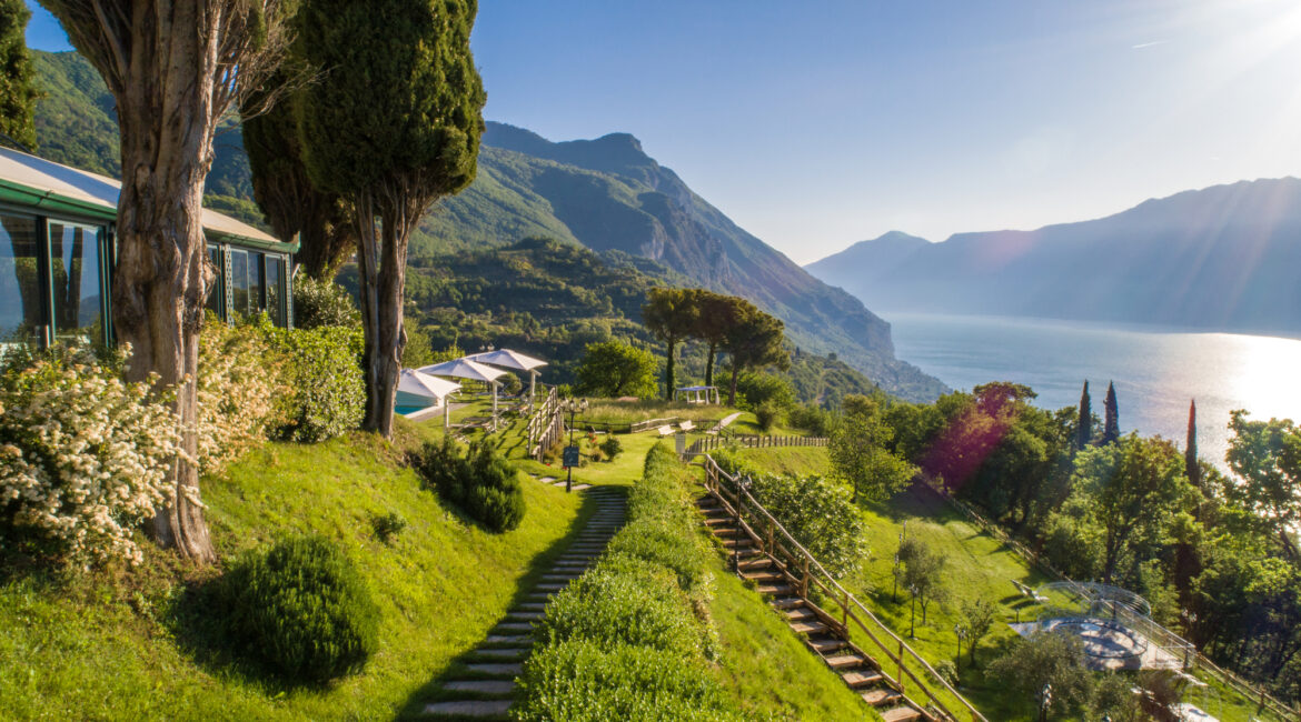 Manicured garden terraces with outdoor seating overlooking Lake Garda
