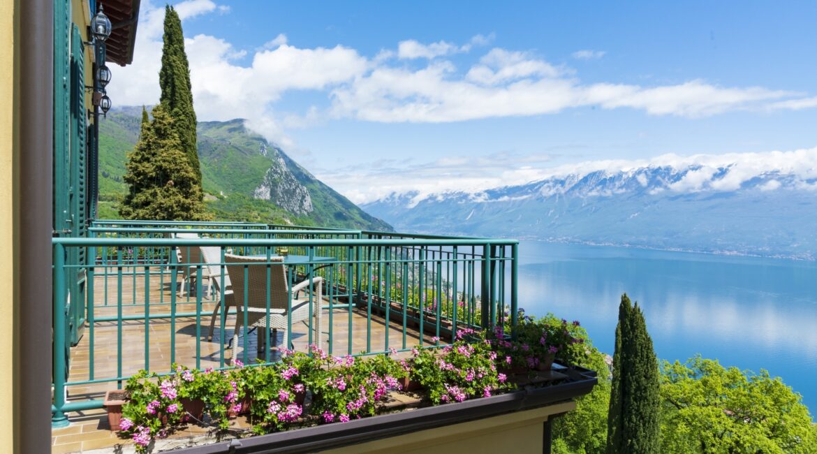Outdoor terrace with lake views at Villa Sostaga boutique hotel