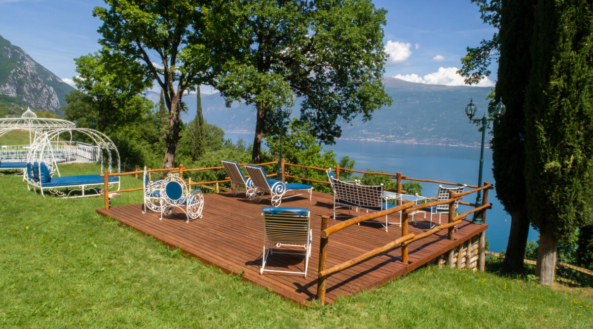 Panoramic terrace with outdoor seating overlooking Lake Garda