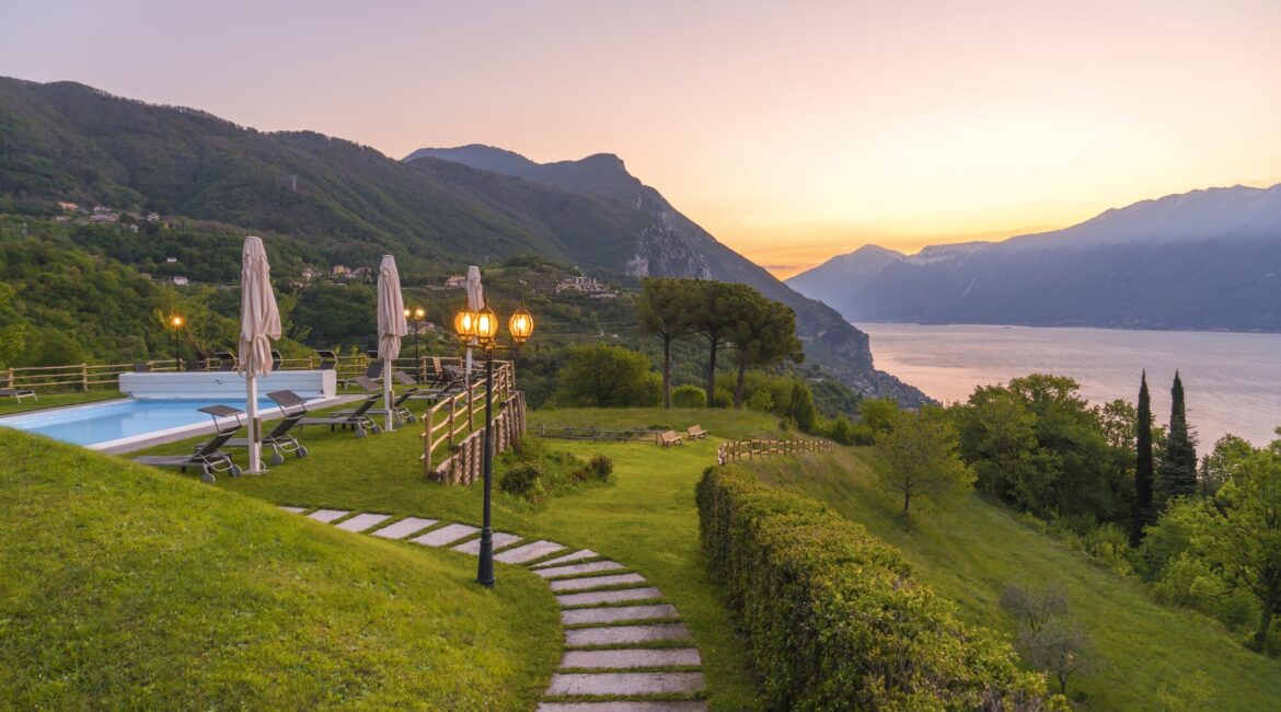 Peaceful gardens and terrace at Villa Sostaga overlooking Lake Garda
