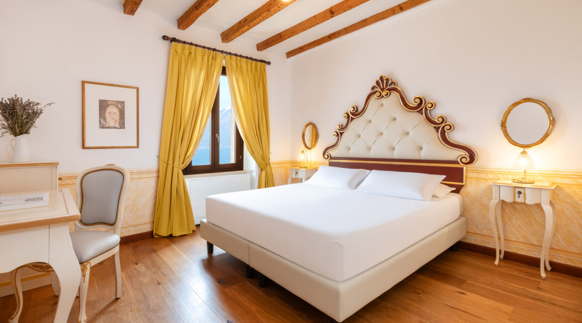 Spacious suite at Villa Sostaga boutique hotel overlooking Lake Garda