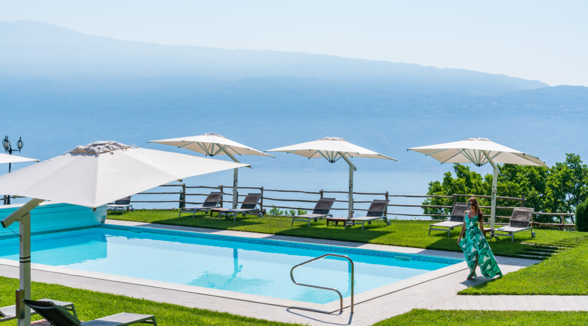 Sswimming pool at Villa Sostaga with panoramic views across Lake Garda