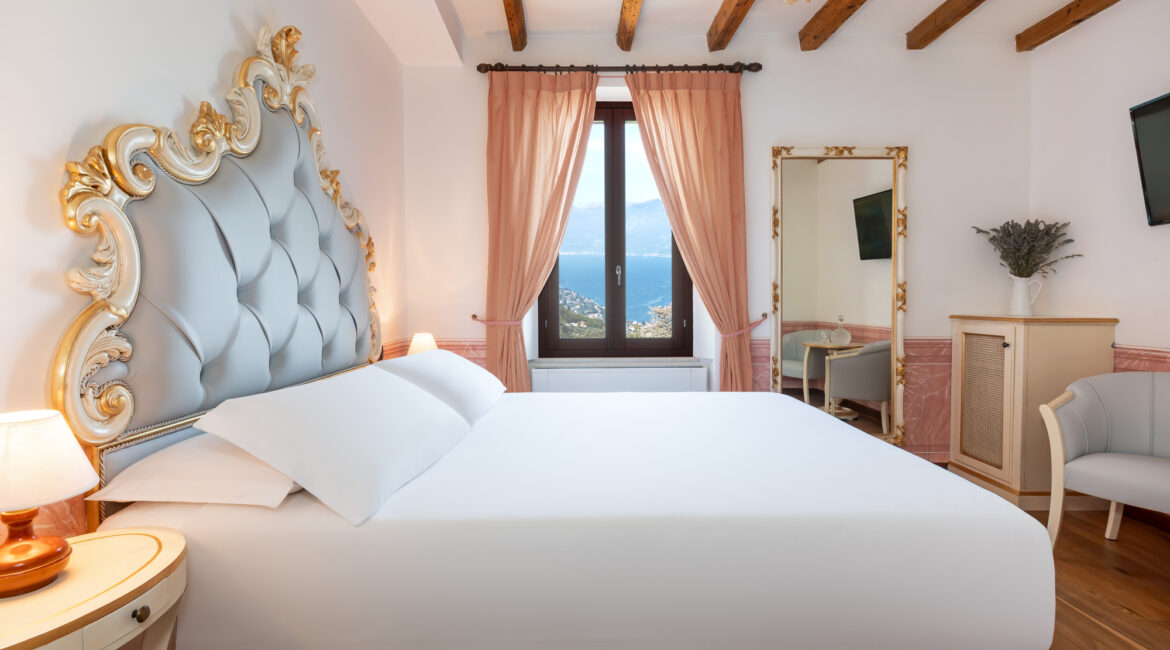 Stunning suite at Villa Sostaga boutique hotel overlooking Lake Garda