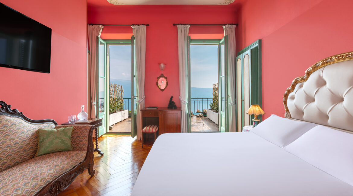 Stylish guest room with lake views at Villa Sostaga boutique hotel