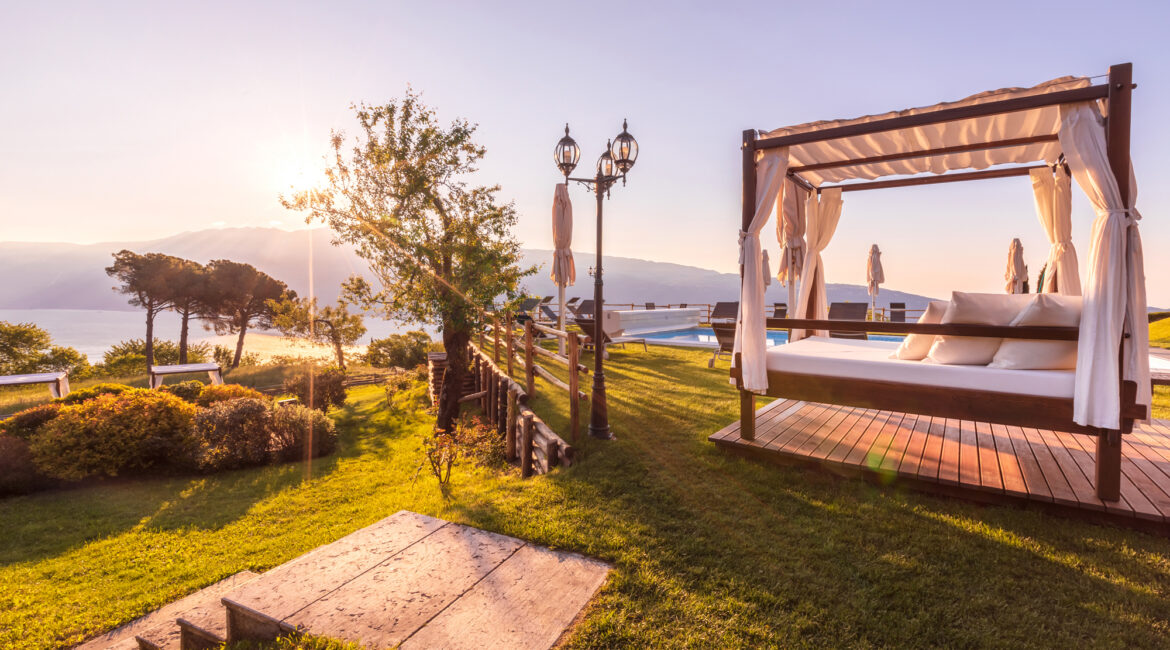 Sunset relaxation area at Villa Sostaga with views across Lake Garda
