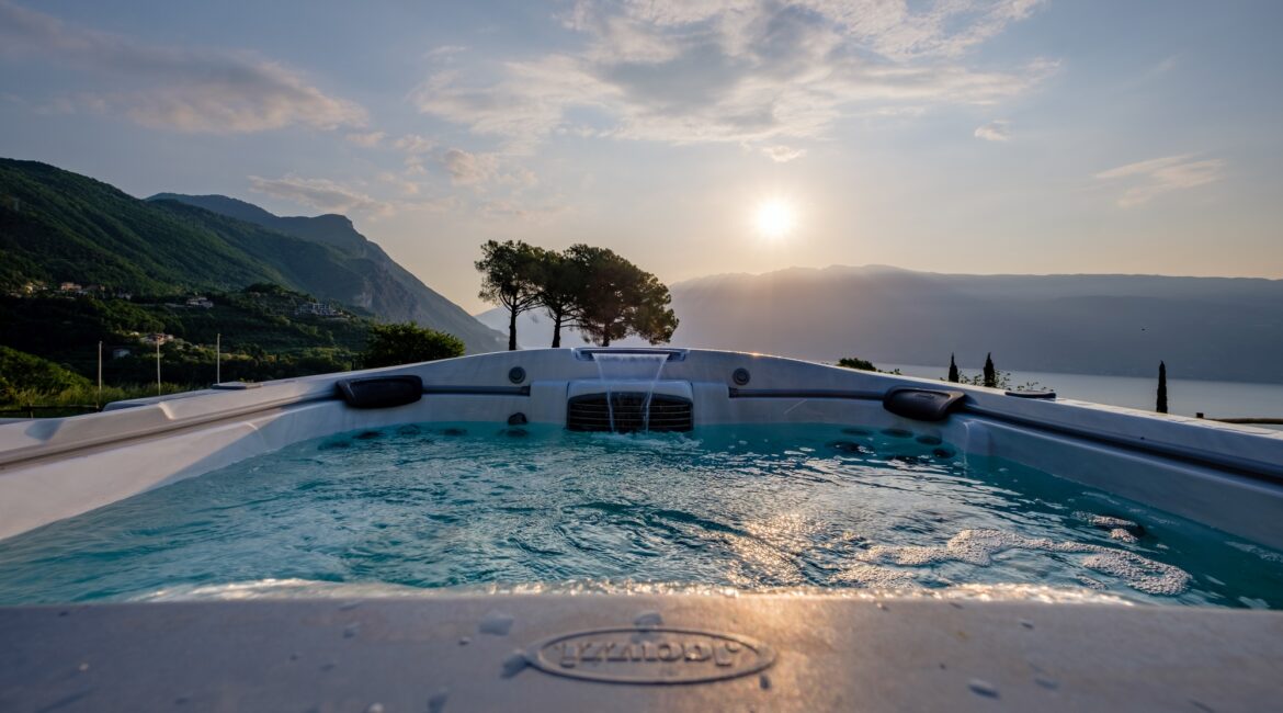 Sunset view from the jacuzzi at Villa Sostaga with panoramic views over Lake Garda