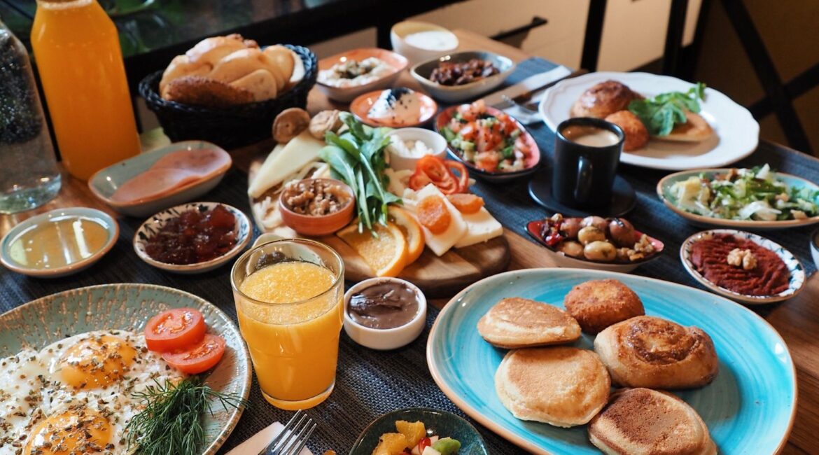 Abundant Turkish breakfast table at Hotel Poem in Istanbul with local dishes, pastries and juices