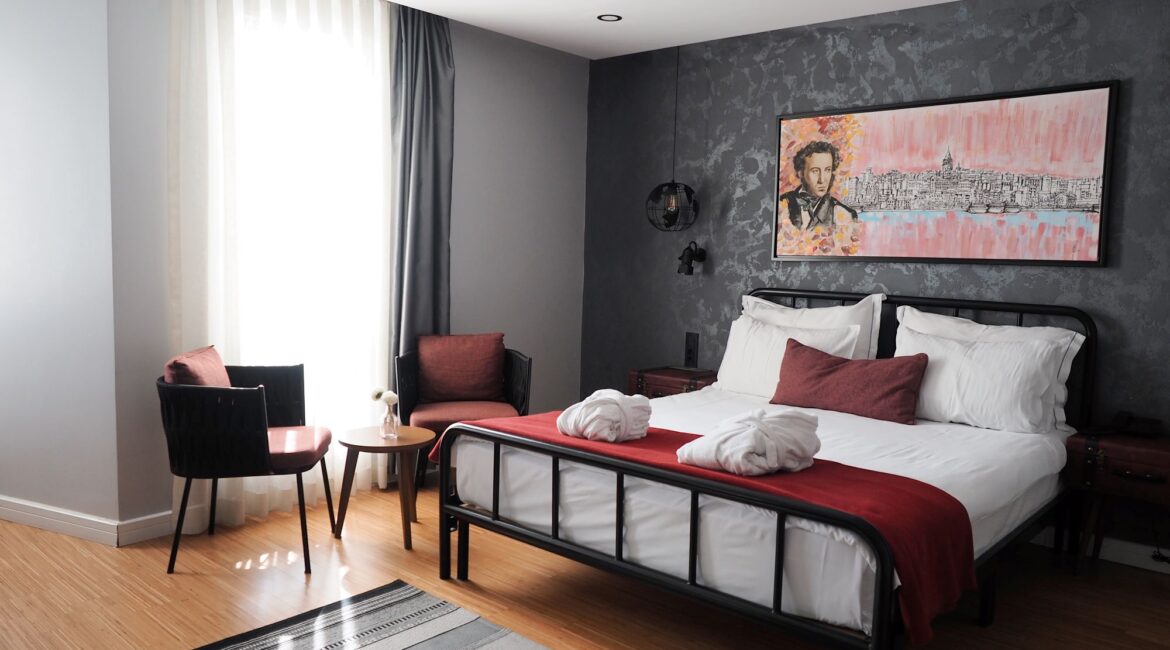 Generous superior room at Hotel Poem, Sultanahmet, with king-size bed, lounge seating and city light