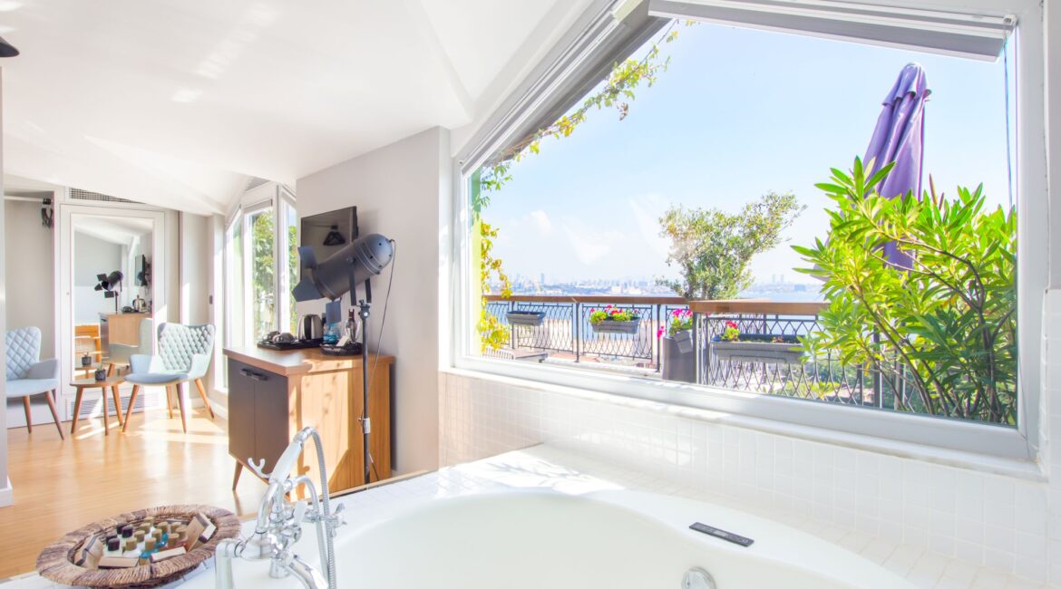 Penthouse bathroom at Hotel Poem, Sultanahmet, with whirlpool bath and views towards the sea