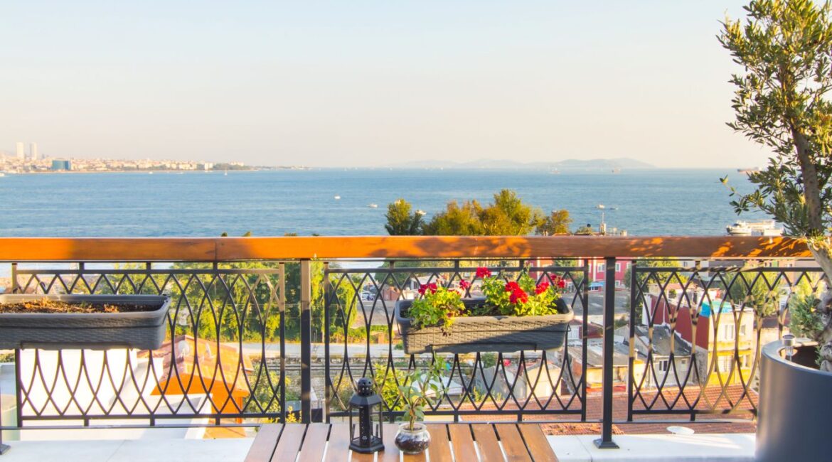 Rooftop terrace seating area at Hotel Poem, Sultanahmet, overlooking the sea and surrounding rooftops