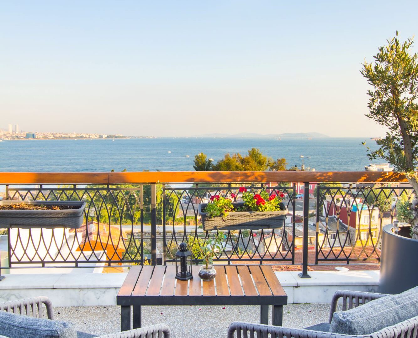 Rooftop terrace seating area at Hotel Poem, Sultanahmet, overlooking the sea and surrounding rooftops