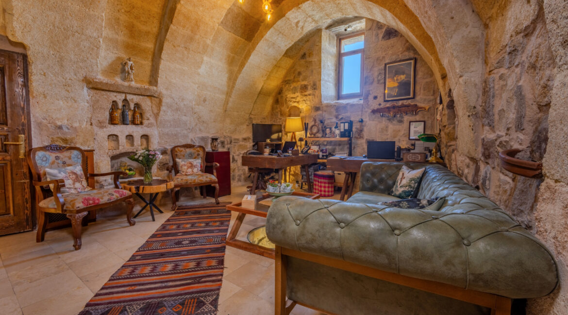 Cave-style lounge area reception with traditional furnishings at Eyes of Cappadocia