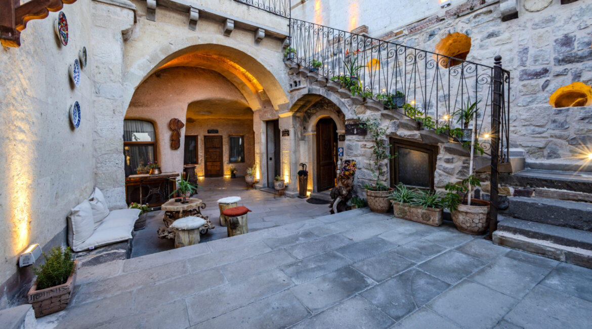 Inner courtyard at Eyes of Cappadocia with arched walkways and seating areas