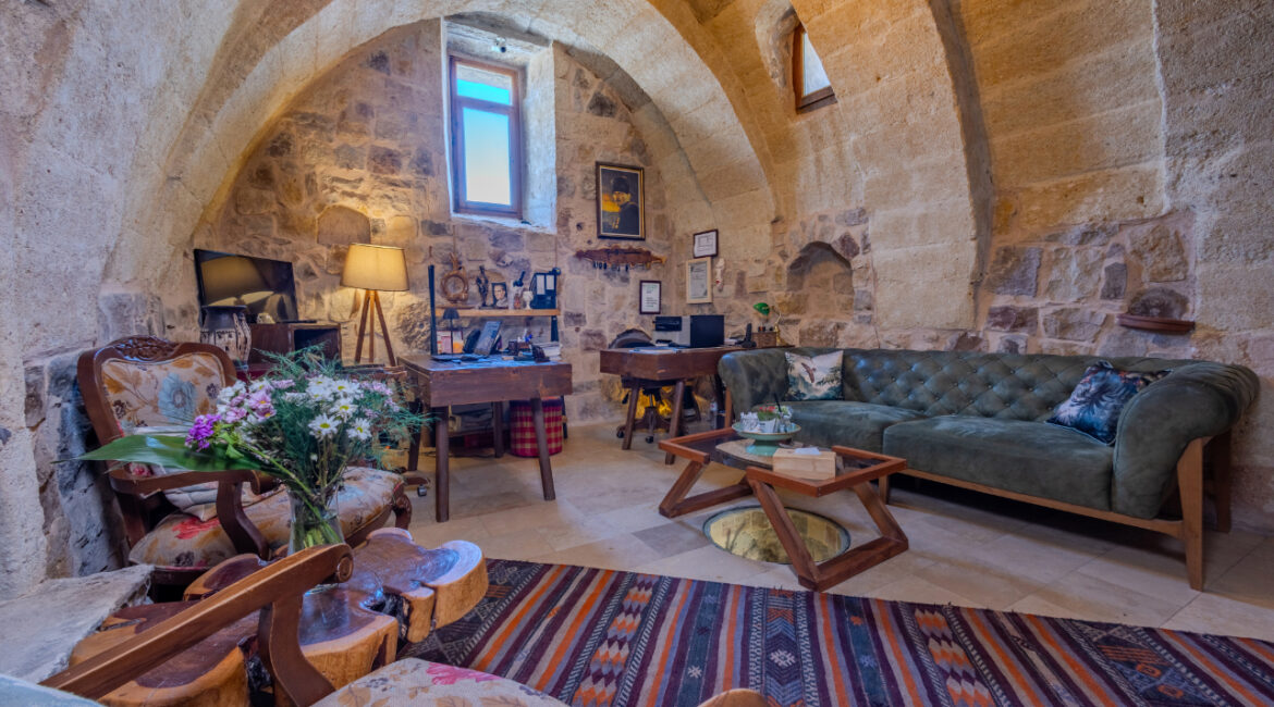 Reception lounge with vaulted stone ceilings and cosy seating in Cappadocia