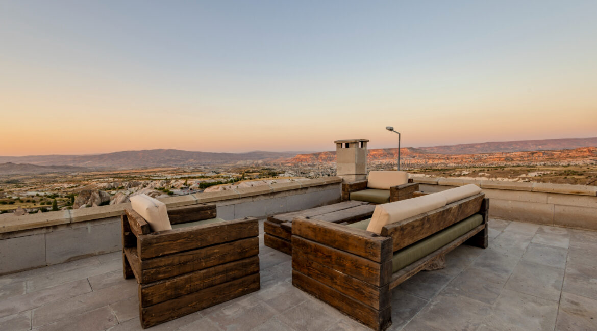 Terrace seating area with uninterrupted views across Cappadocia’s valleys