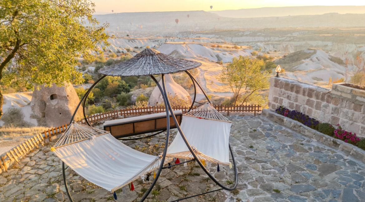 Garden swing seating with panoramic views over Cappadocia’s landscape near Uçhisar