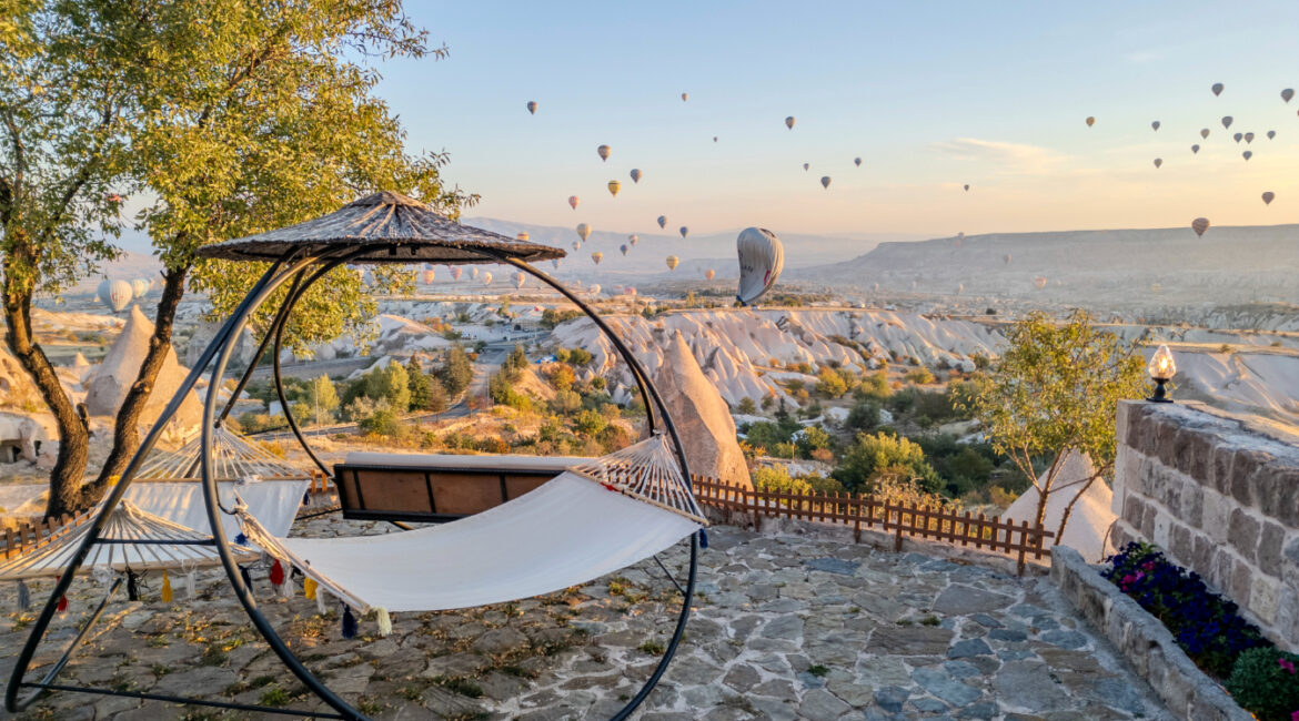 Peaceful outdoor seating area in Uçhisar with views across Cappadocia’s valleys