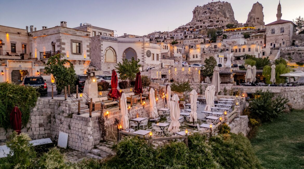 Aerial view of Eyes of Cappadocia terraces overlooking Uçhisar at sunset