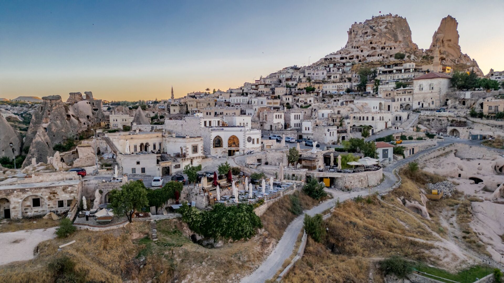 Aerial view of Uchisar with castle rock formation and surrounding cave dwellings