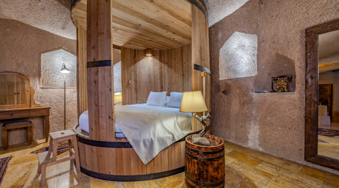 Cellar King Suite No 110 with round bed and traditional stone architecture