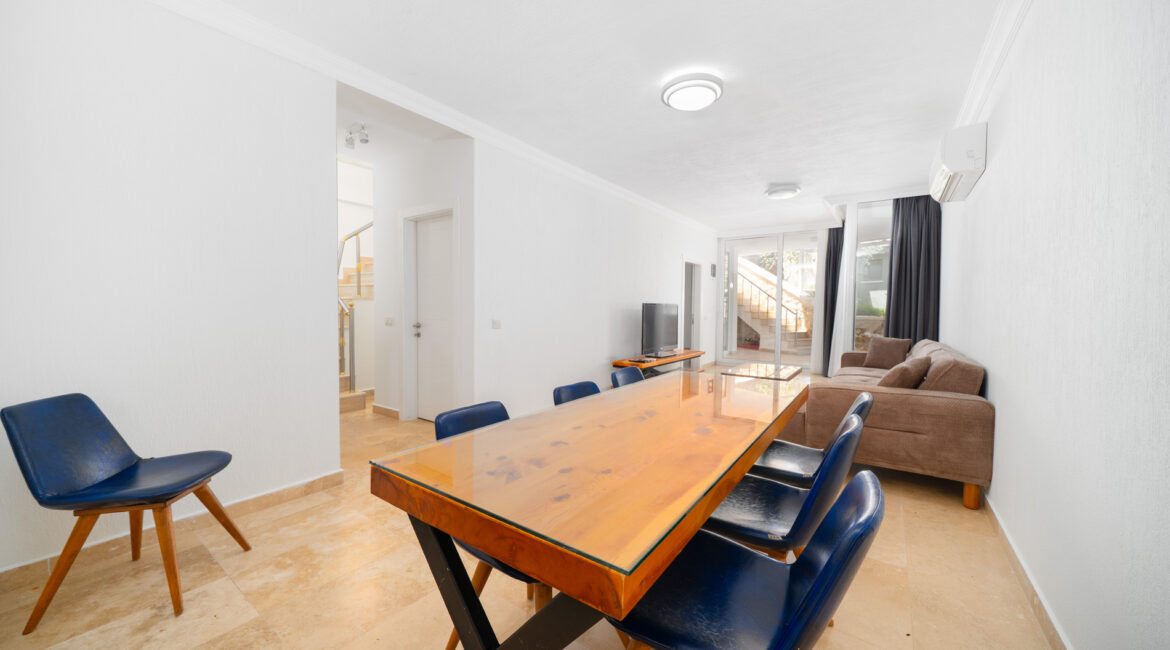 Dining area at Villa Cennet Koy Kalkan with wooden table and open-plan layout