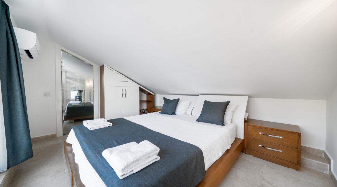 Double bedroom at Villa Cennet Koy Kalkan with simple modern interiors and natural light