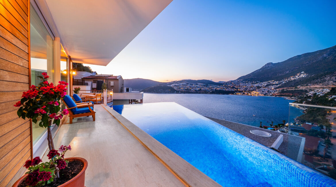 Infinity pool at Villa Cennet Koy Kalkan at sunset with views across Kalkan Bay