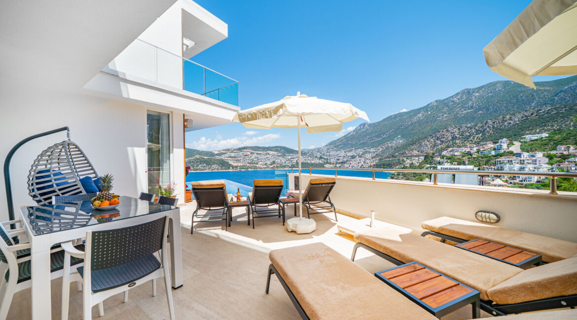 Outdoor lounge terrace at Villa Cennet Koy Kisla with seating and views over Kalkan Bay