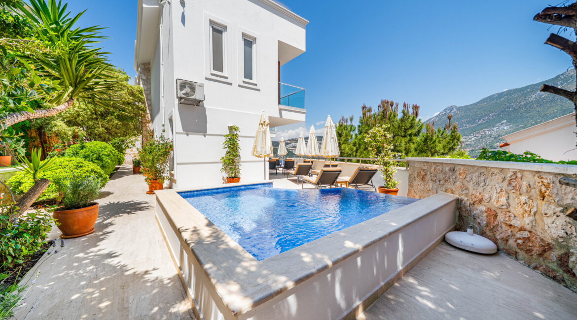 Private pool terrace at Villa Cennet Koy Kisla with sun loungers and stone walls