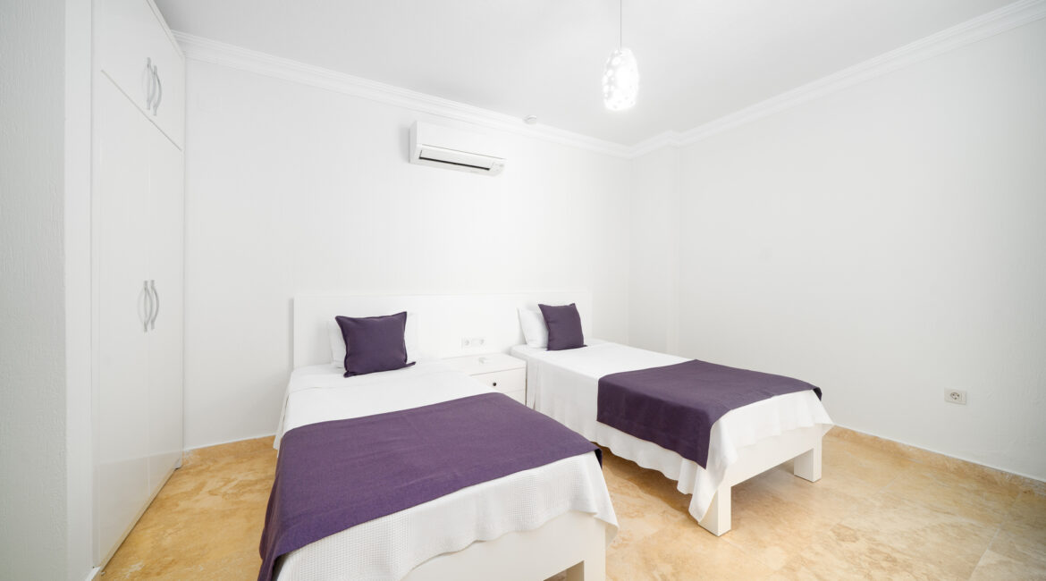Twin bedroom at Villa Cennet Koy Kalkan with minimalist interiors and natural light
