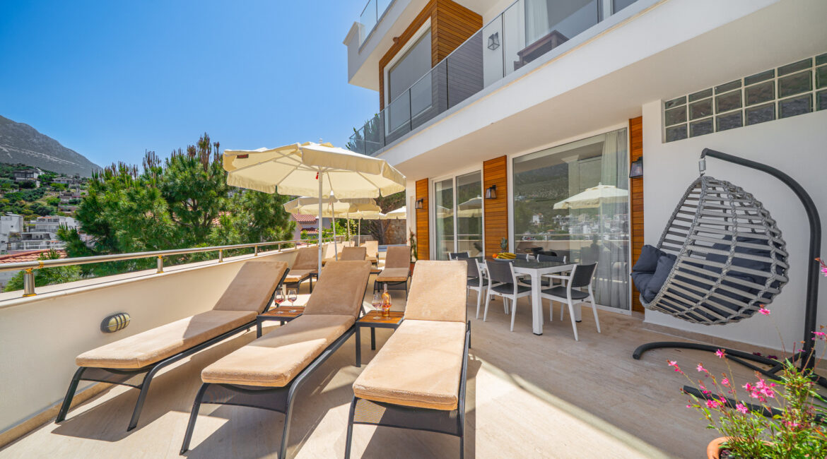 Wrap around terrace at Villa Cennet Koy Kalkan with sun loungers and outdoor seating area