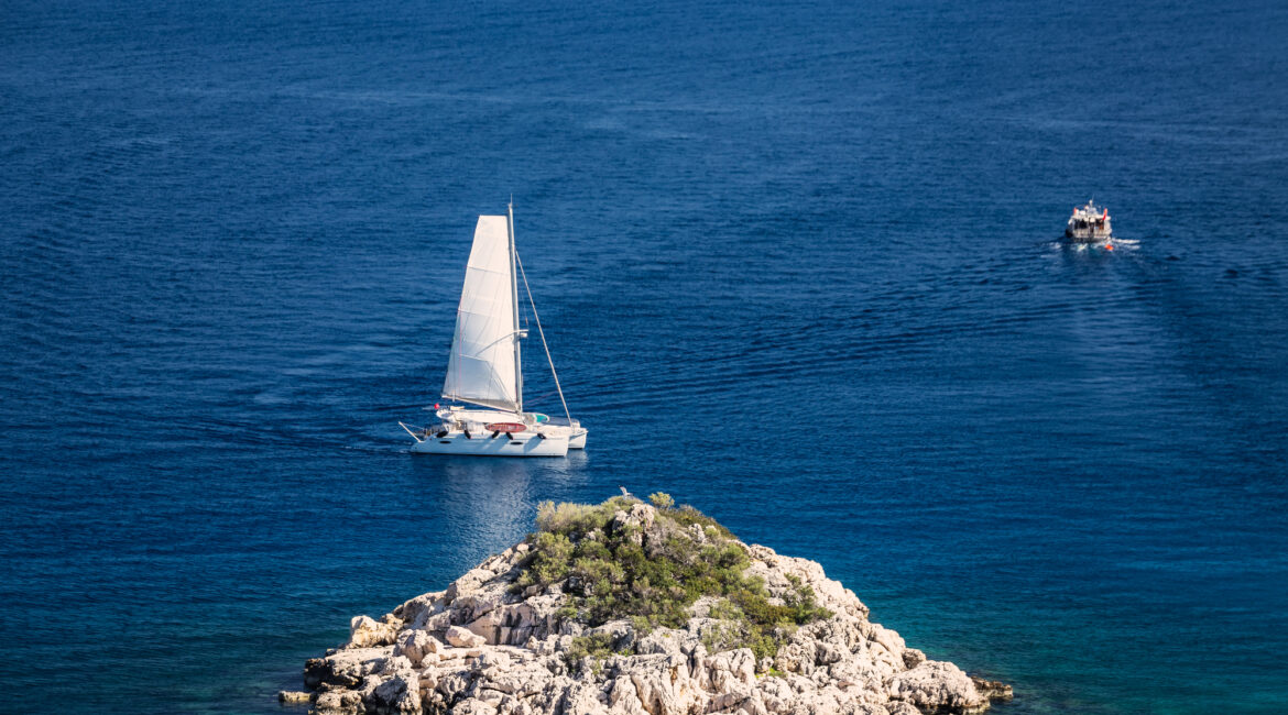 Sailing yacht on deep blue water off the coast of Kaş