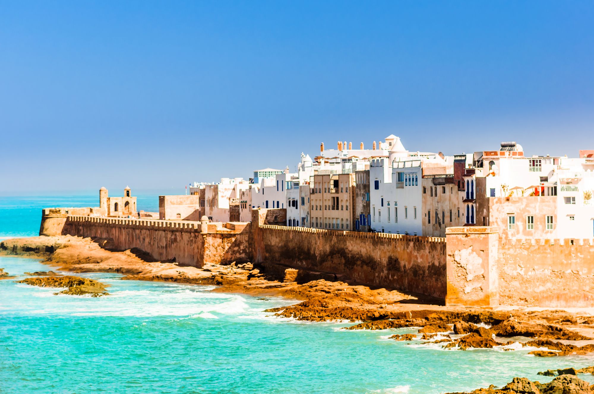 Turquoise water and sandy shoreline along the Essaouira coast