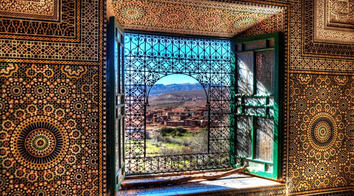 Ornate Moroccan interior with window view over the Atlas Mountains