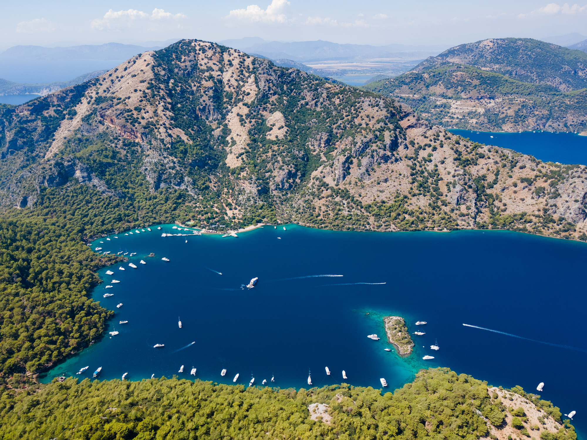 Aerial view of Gocek bay with yachts and mountainous coastline, luxury sailing destination Turkey