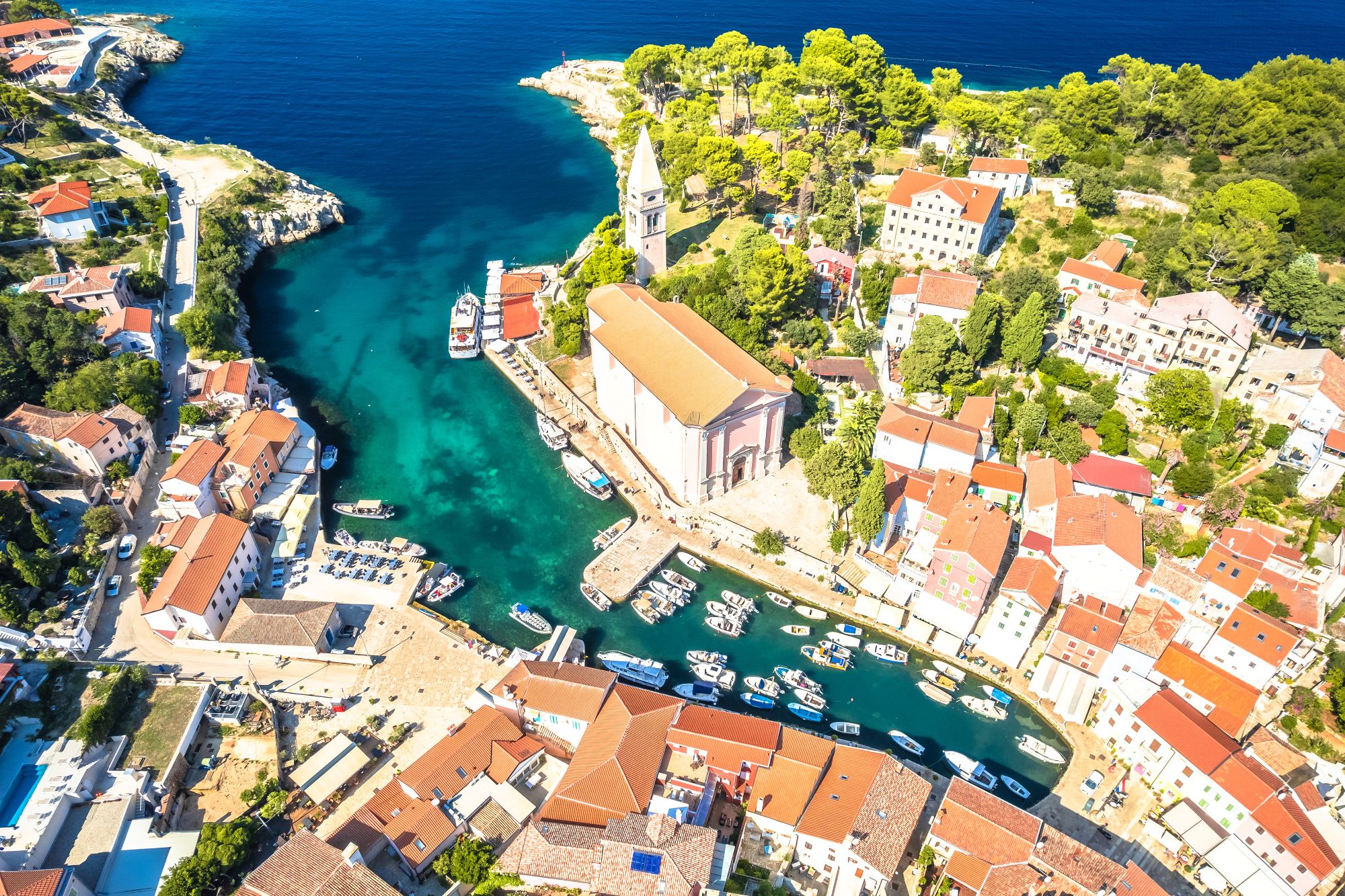 Aerial view of Veli Losinj coastline and turquoise bay, Croatia