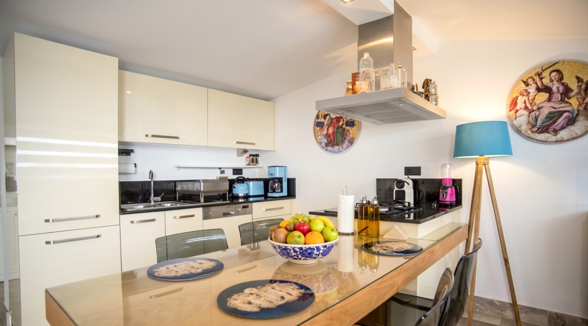 Comfortable kitchen and dining area at Topaz Penthouse Kalkan with contemporary furnishings