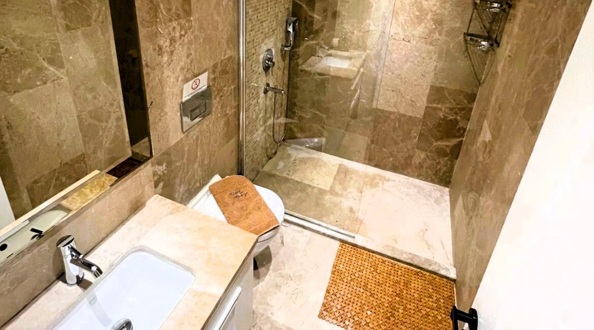 Contemporary marble bathroom with walk-in shower at Topaz Penthouse Kalkan
