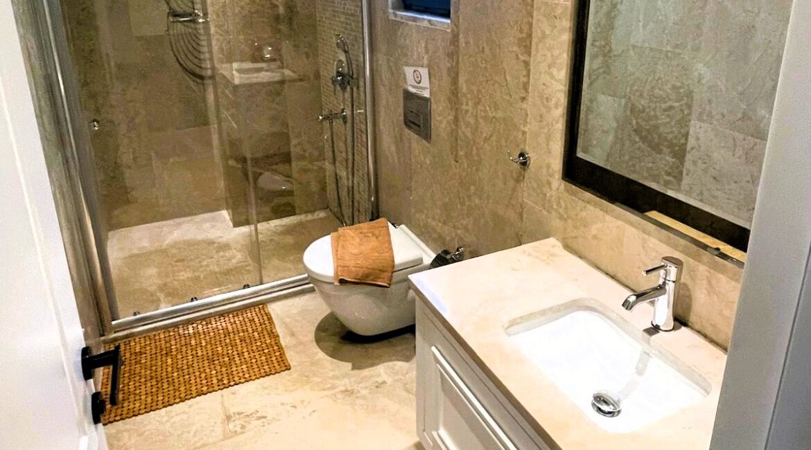 Contemporary en-suite marble bathroom for the second bedroom at Topaz Penthouse Kalkan